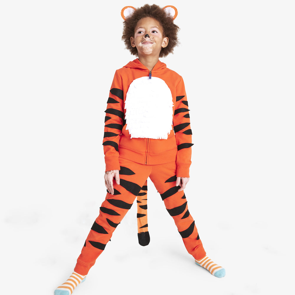 Tiger: A kid wearing an orange outfit with Tiger stripes and a headband with ears