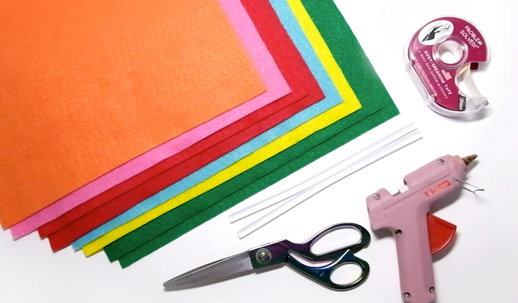image of rainbow felt, hot glue gun, fabric tape and scissors
