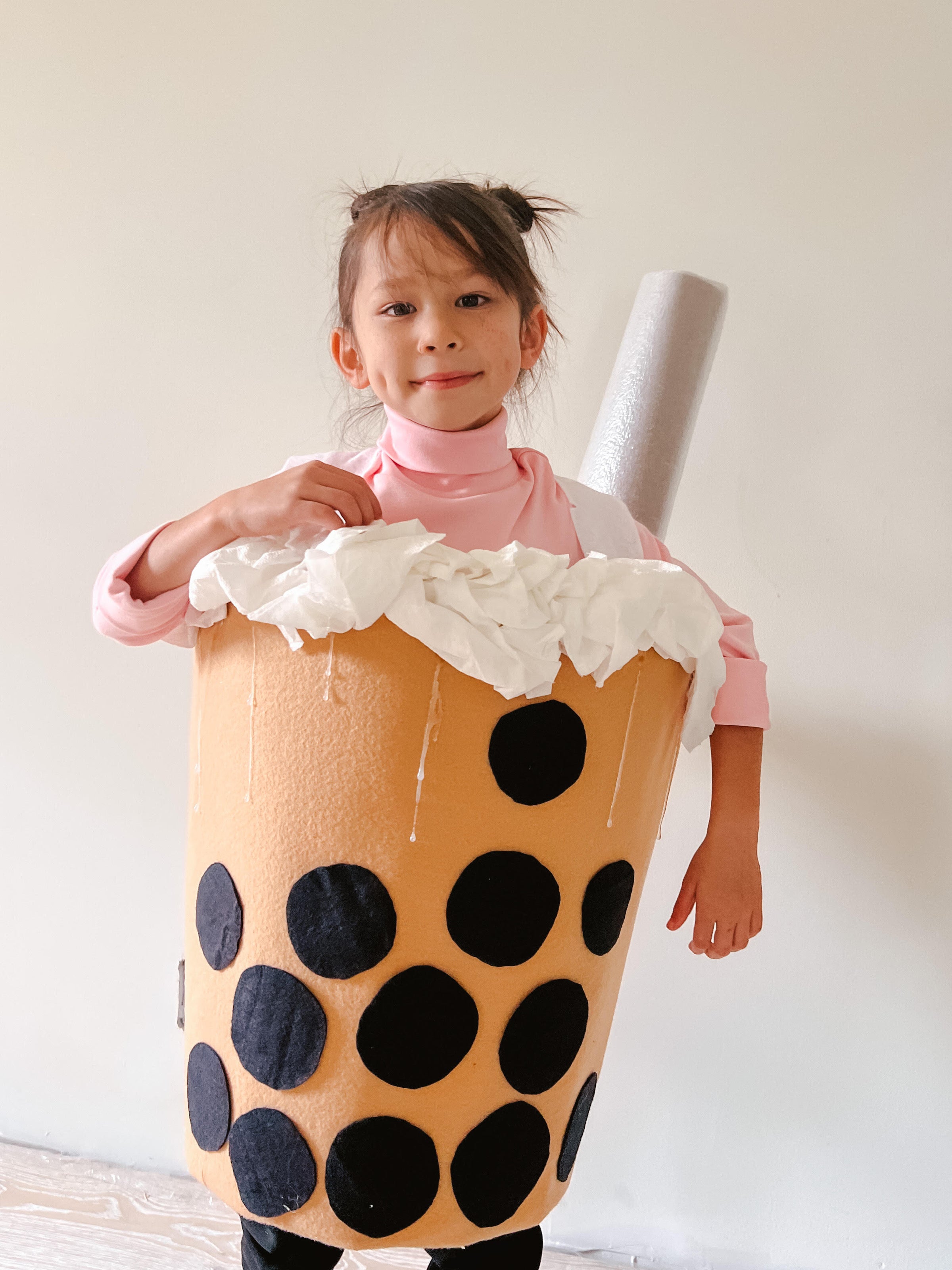 Boba Tea: A child wearig a pink top and black bottom, with DIY boba tea coveralls