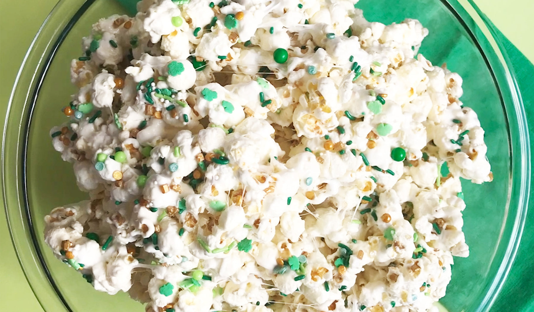 bowl of marshmallow popcorn with green sprinkles