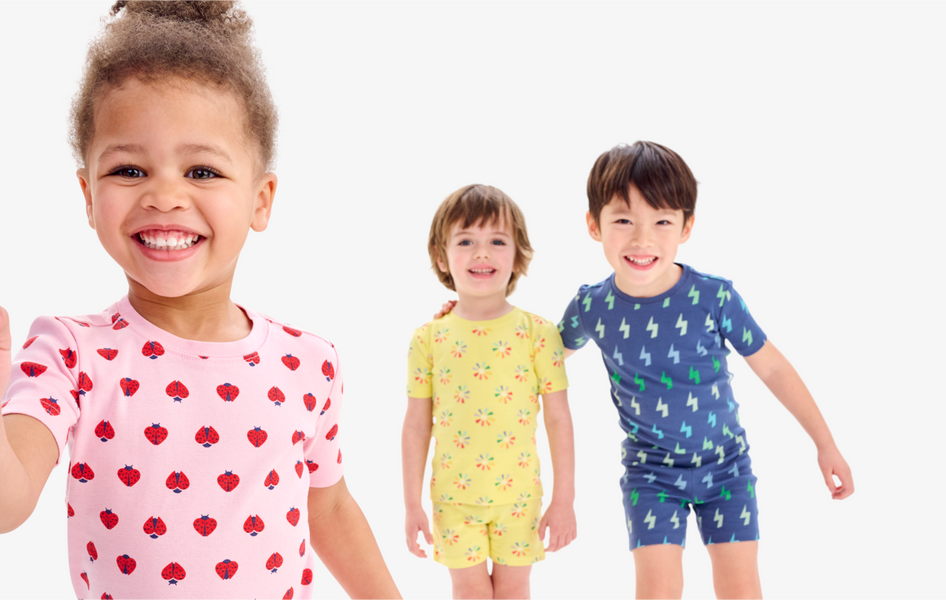3 kids running and holding hands wearing our signature solid PJs.