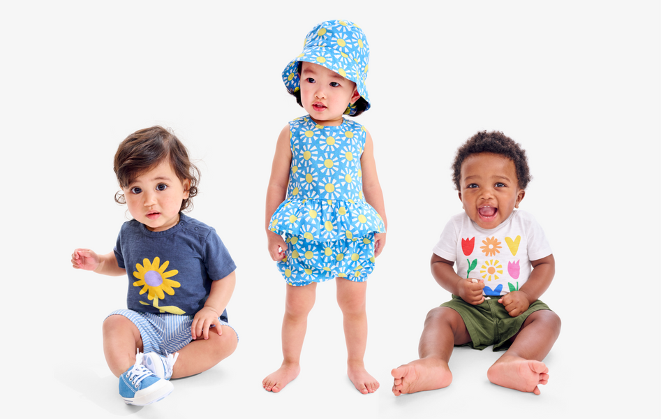 3 babies side by side wearing new spring clothing including tees, bodysuits, and shorts