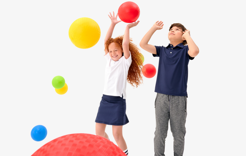 2 children playing with kickballs wearing flexknit active clothing