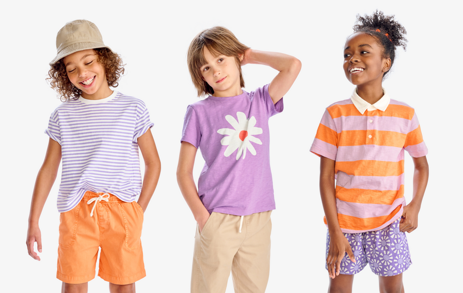 3 kids wearing a mix of tees and shorts in our lavender and cantaloupe colors