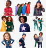 A grid of 9 photos showing our holiday product thst includes dresses, puffers, PJs, and sweaters. 