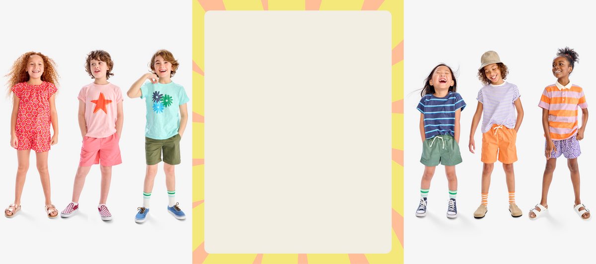 A group of kids standing side by side wearing different tees and shorts in a rainbow of colors.