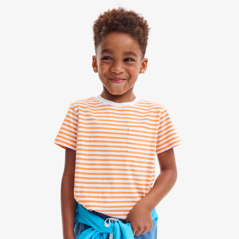 Child wearing a striped shirt with a white background