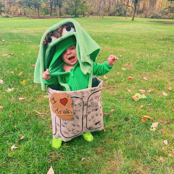 A baby dressed up as Oscar the Grouch.