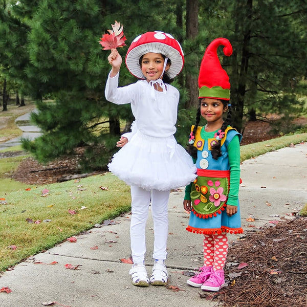 Two kids wearing gnome and shroom costumes.