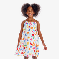 An image of a girl in our tank dress in rainbow garden party